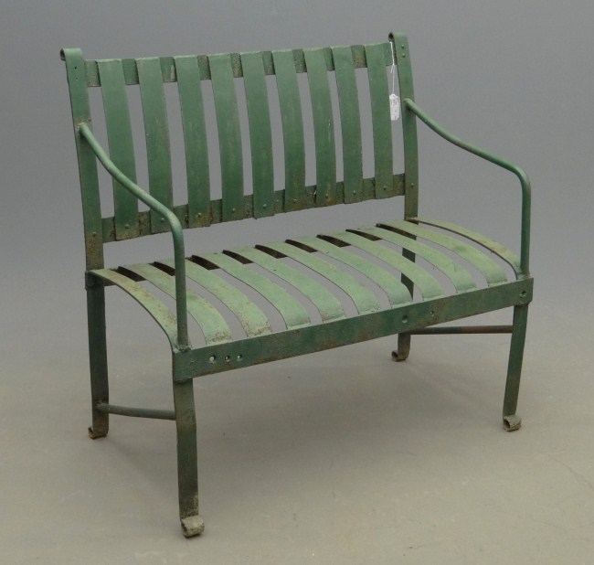 Early outdoor strap iron bench in