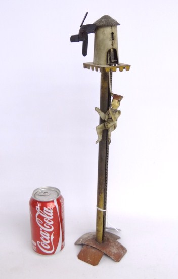 Early tin toy with man and