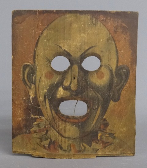Early wooden clown face carnival