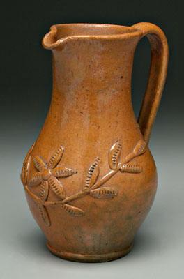 Earthenware pitcher, orange and