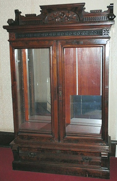 Eastlake carved walnut bookcase
