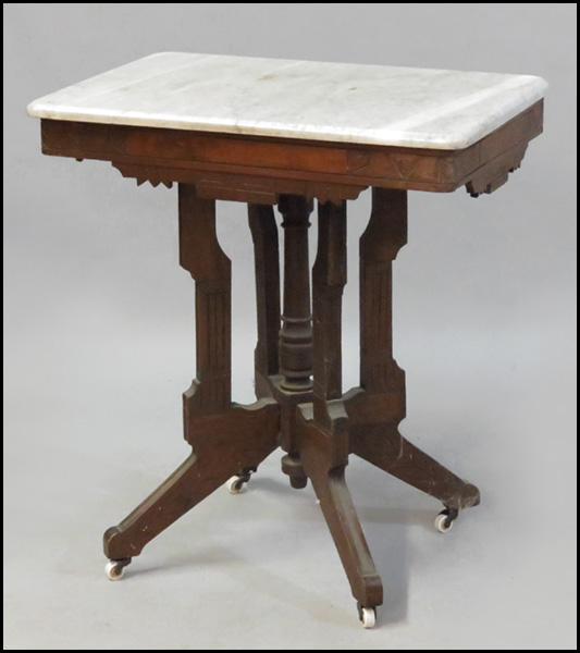 EASTLAKE CARVED WALNUT TABLE.