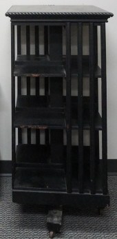 EBONIZED WOOD REVOLVING BOOKCA