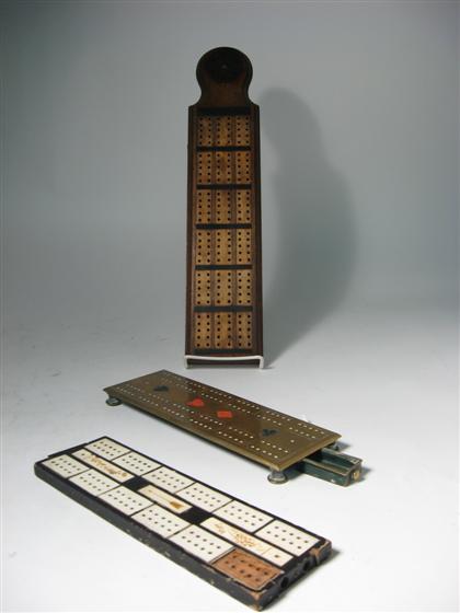 Ebony and ivory, brass and walnut