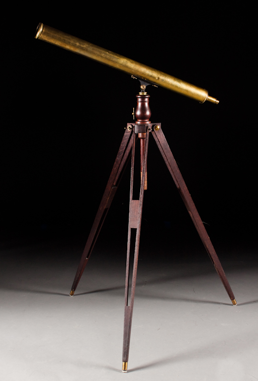 Edwardian brass telescope on an oak