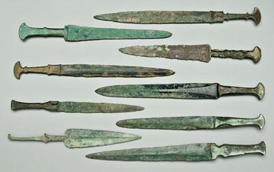 Eight ancient bronze daggers: