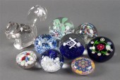 Eight assorted glass paperweig