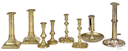 EIGHT BRASS CANDLESTICKS AND