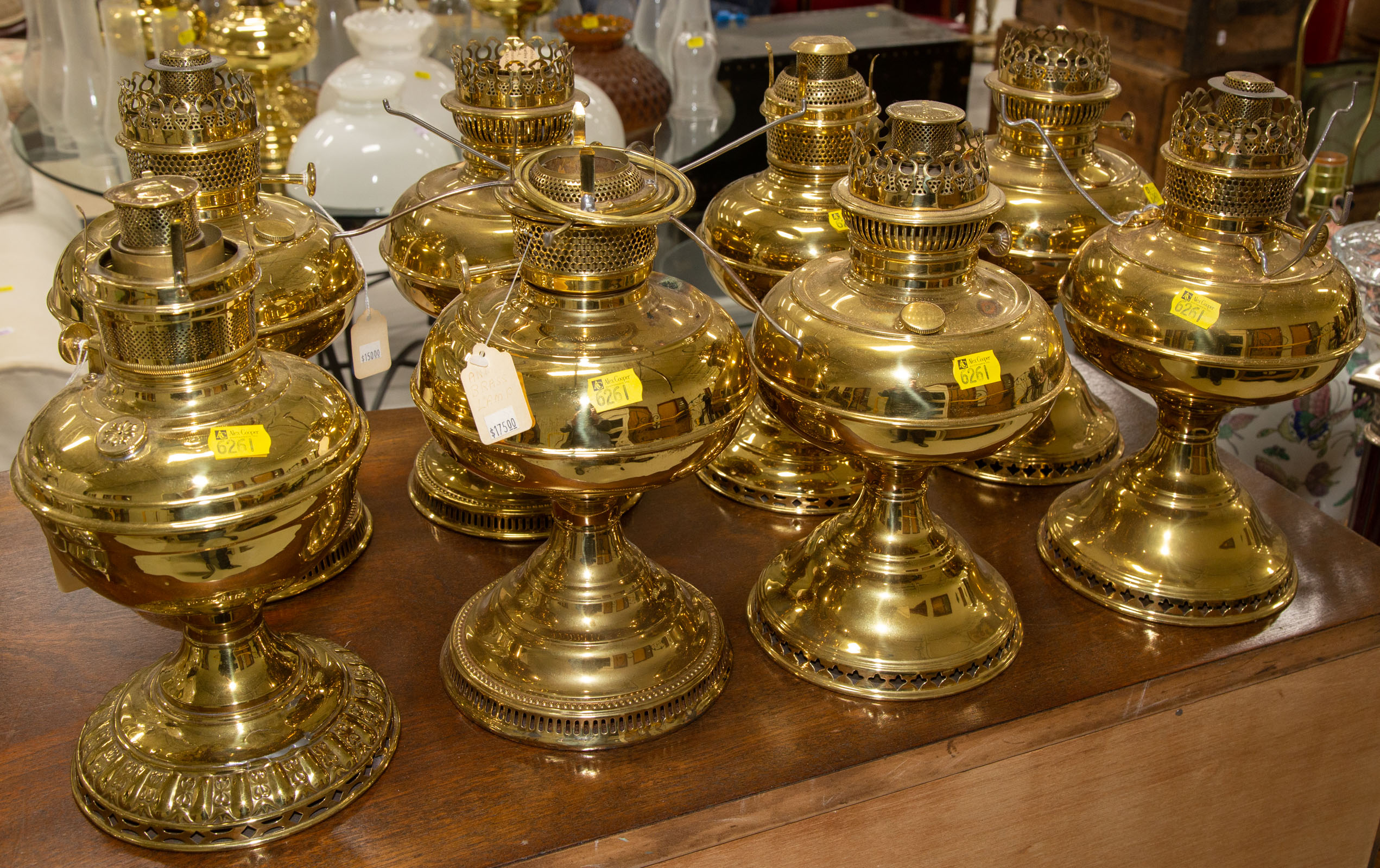 EIGHT BRASS OIL LAMPS .