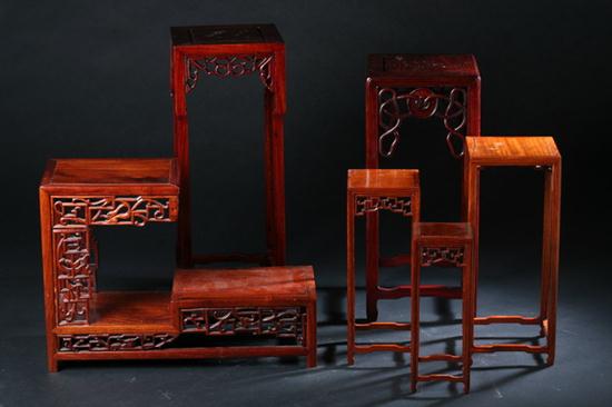 EIGHT CHINESE WOOD STANDS. Four