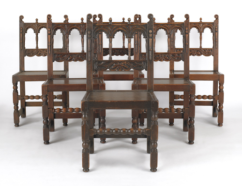 Eight Jacobean style dining chairs.