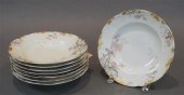 EIGHT LIMOGES FLORAL GILT DECO