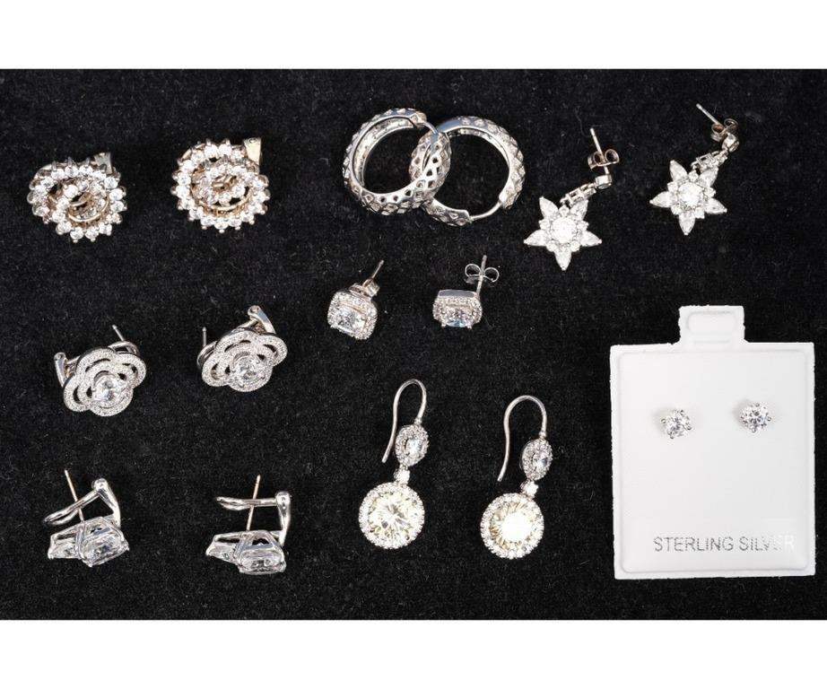 Eight pair of costume earrings,