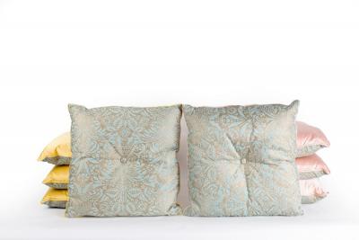 Eight patterned cushions with