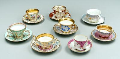 Eight porcelain cups and saucers: