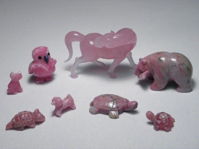 Eight rose colored carved stone