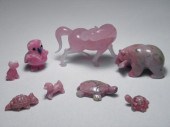 Eight rose colored carved ston
