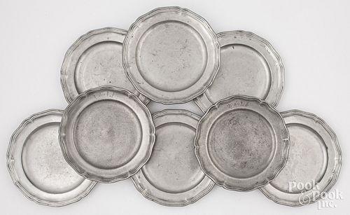 EIGHT SCALLOP EDGE PEWTER PLATES,