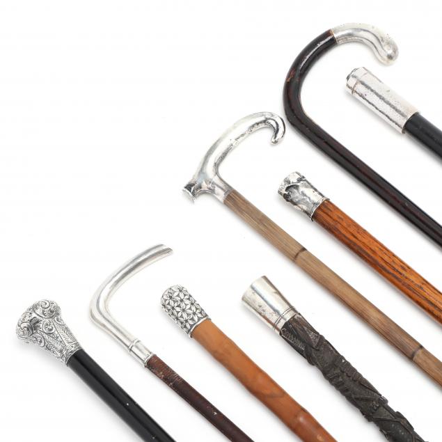 EIGHT SILVER HANDLED CANES