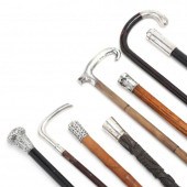 EIGHT SILVER HANDLED CANES Inc