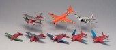 Eight toy airplanes: six paint