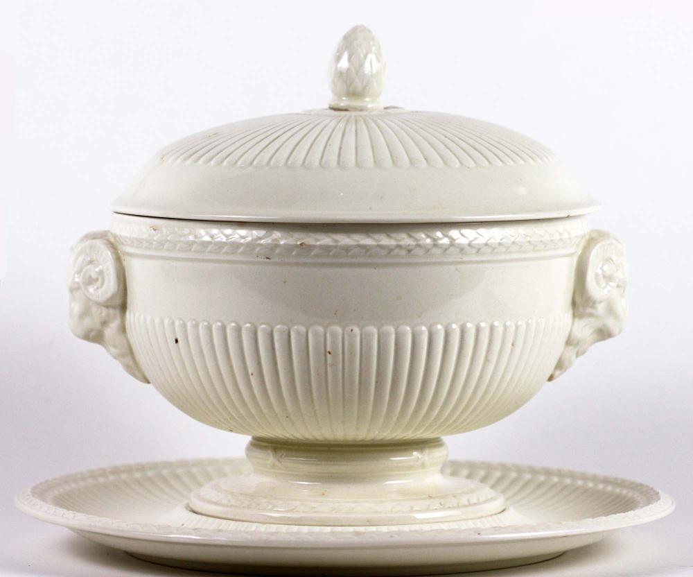 EIGHTEEN CREAMWARE POTTERY TABLE