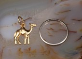 EIGHTEEN KARAT GOLD CHARM AND
