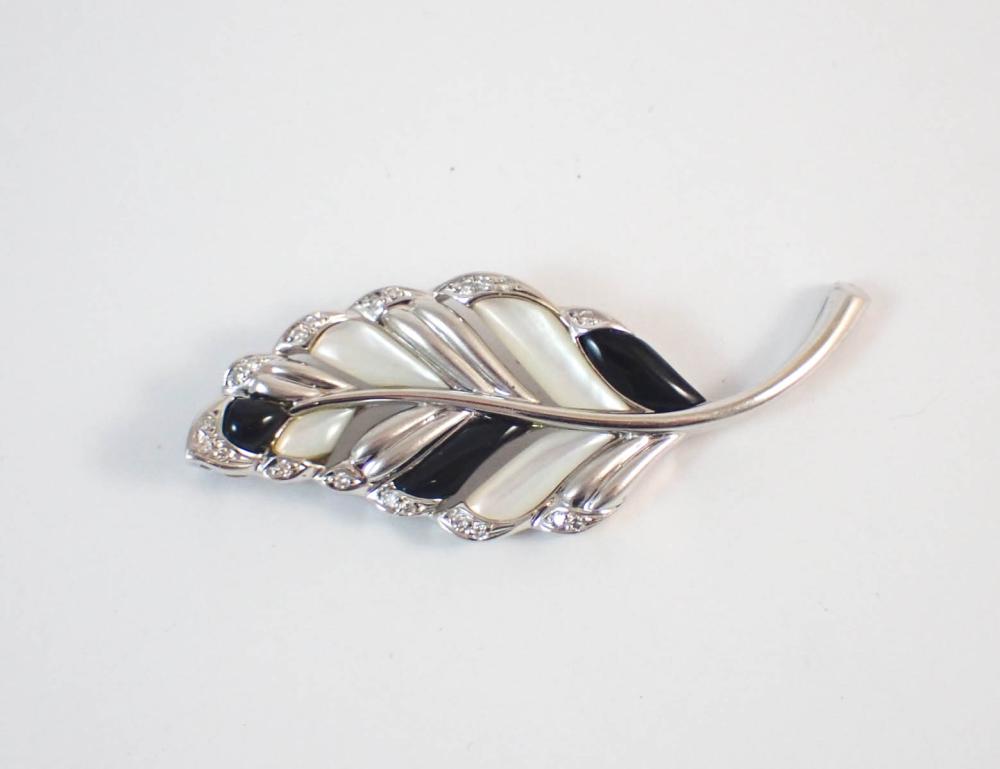 EIGHTEEN KARAT WHITE GOLD LEAF