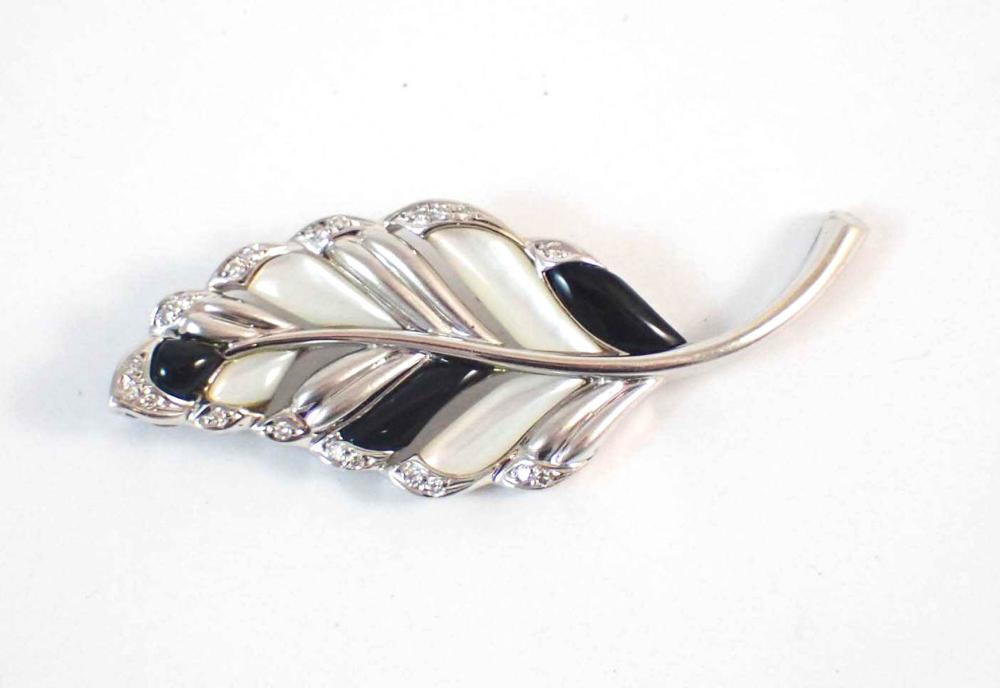EIGHTEEN KARAT WHITE GOLD LEAF