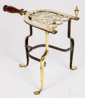ELABORATE BRASS TRIVET, LATE 1