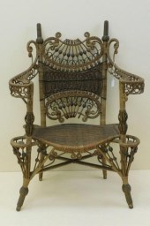 ELABORATE WICKER ARM CHAIR BY