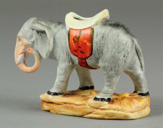 ELEPHANT WITH SADDLE STILL BANK