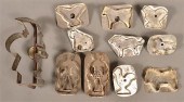 ELEVEN ANTIQUE TIN FIGURAL COO