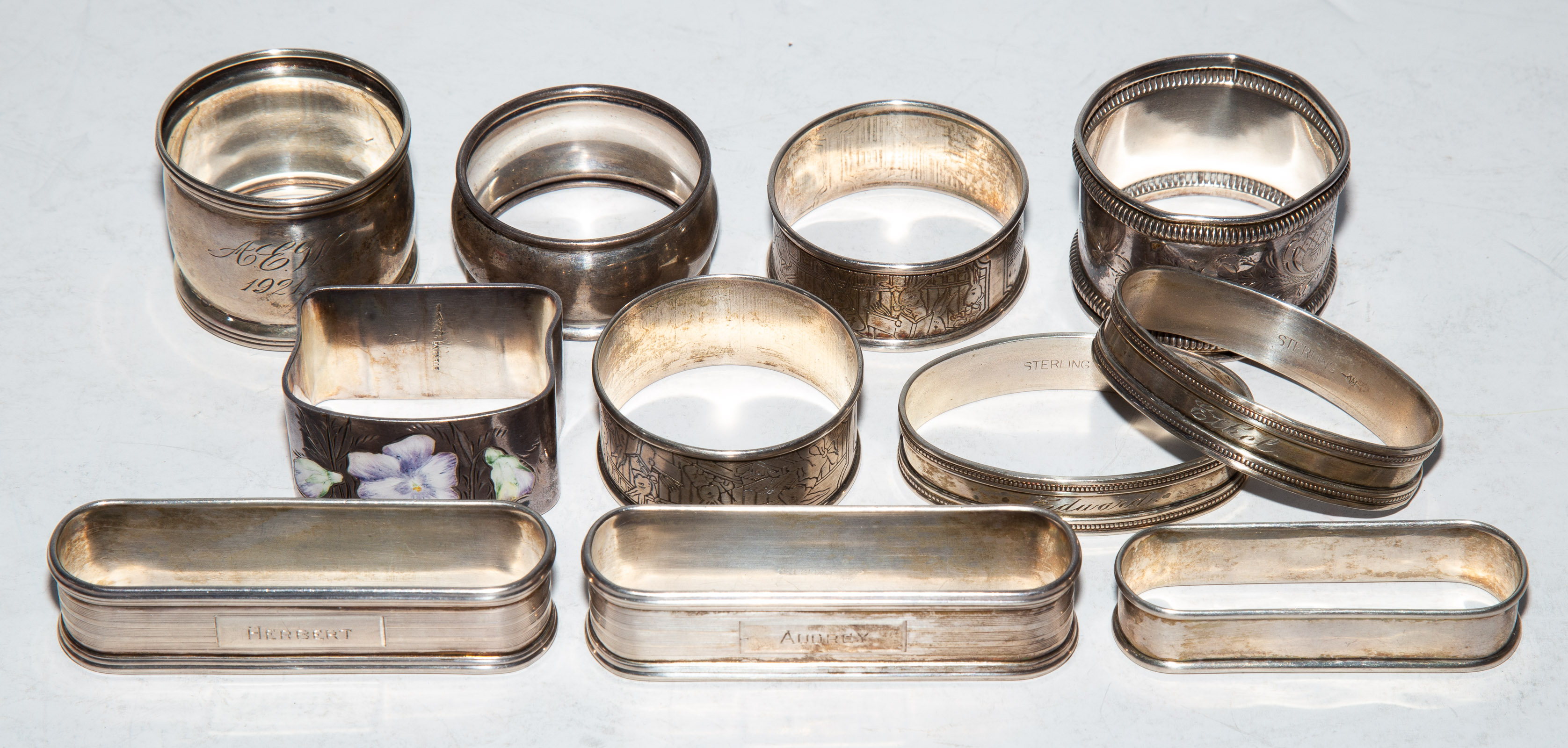 ELEVEN ASSORTED STERLING NAPKIN