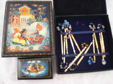 Eleven bone lace bobbins in case