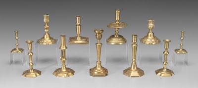 Eleven brass candlesticks: includes