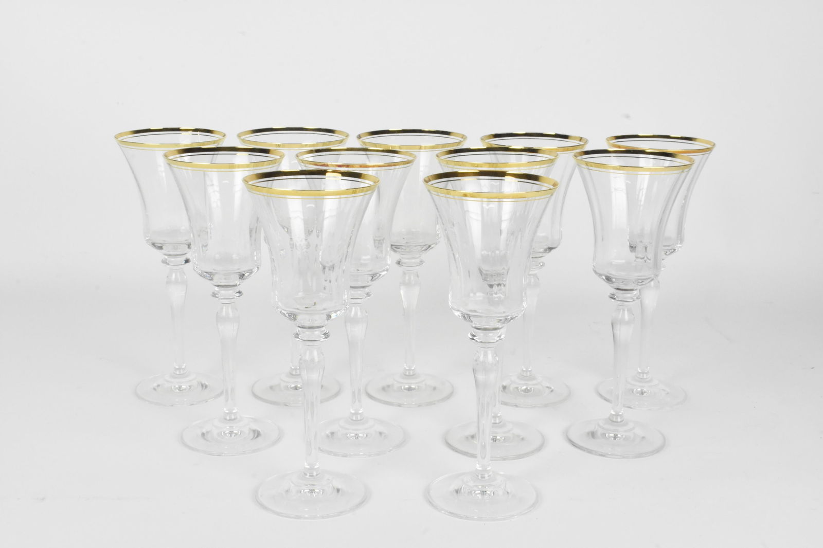 ELEVEN GILT RIMMED TALL STEMMED