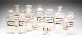 ELEVEN GLASS APOTHECARY JARS.