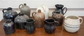 ELEVEN GLAZED STONEWARE CROCKS