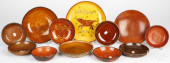 ELEVEN REDWARE PLATES AND SHAL
