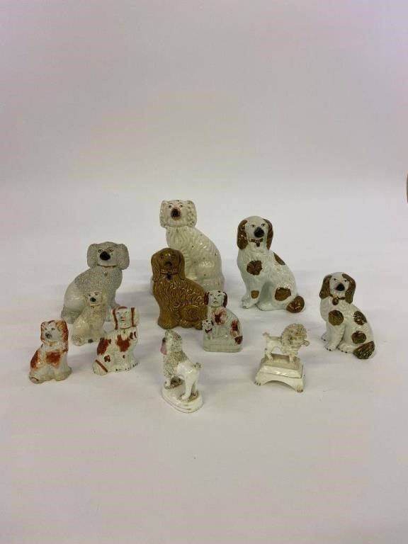 Eleven Staffordshire dogs, circa