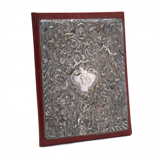 ELIZABETH II SILVER AND LEATHER