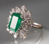 Emerald and diamond ring cente