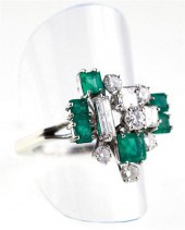 Emerald and diamond ring hand-