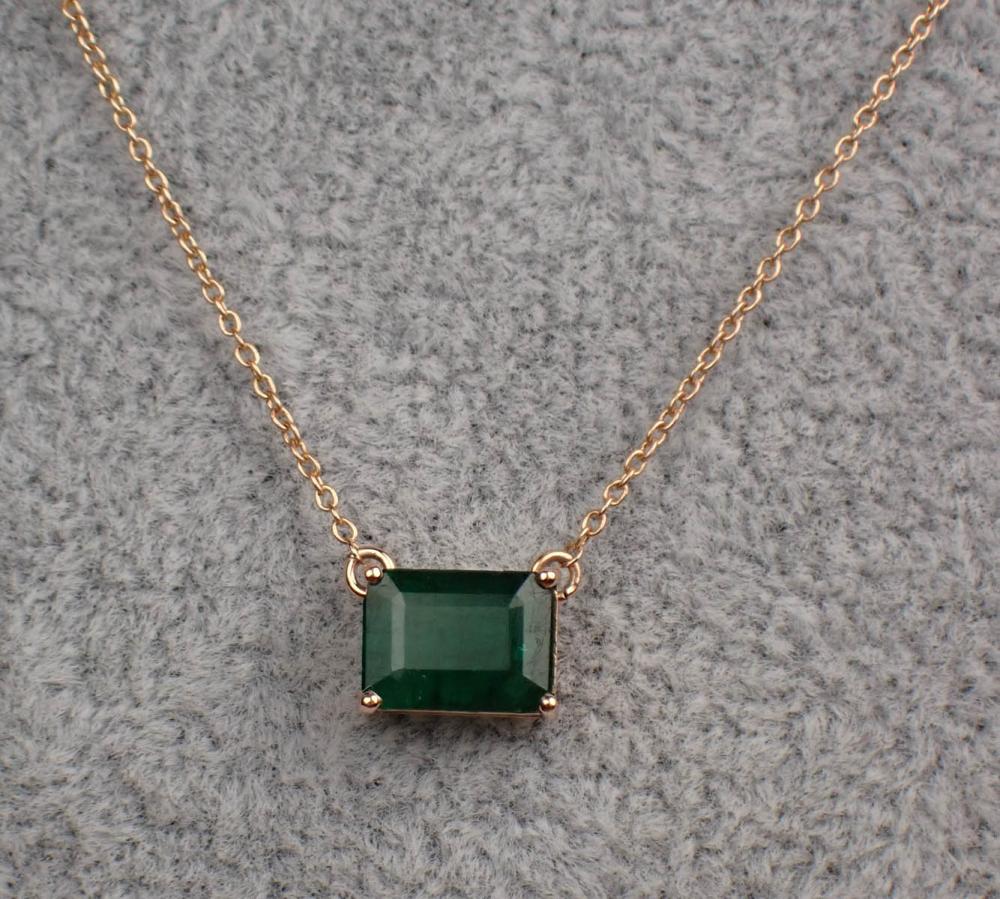 EMERALD AND FOURTEEN KARAT ROSE