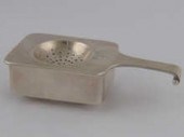 Emmy Roth. A hand raised silve