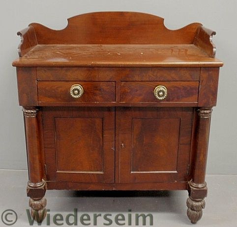 Empire mahogany cabinet with carved
