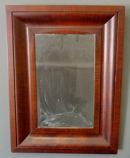 Empire mahogany veneered mirror.