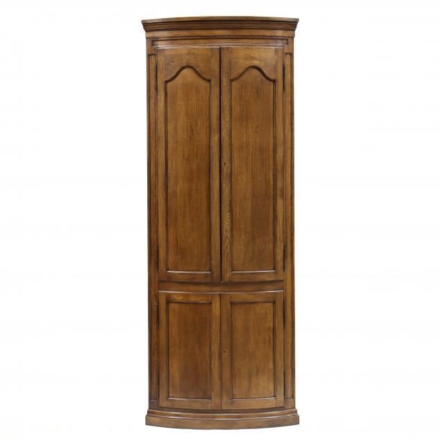 ENGLISH STYLE BOW-FRONT OAK