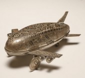 Engraved metal airplane music